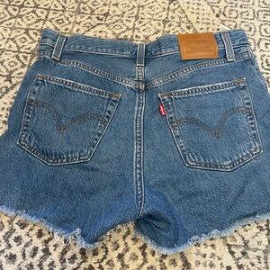 Levi's denim shorts size 28. In excellent condition.  Will ship fast.